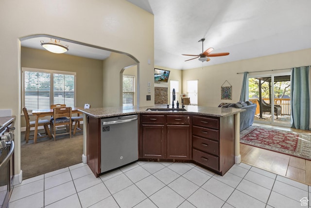 849 E Forest Farm Cir S, Salt Lake City, UT 84106 - kitchen featuring a sink, arched walkways, light tile patterned floors, and stainless steel appliances