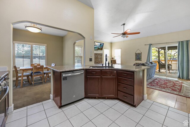 849 E Forest Farm Cir S, Salt Lake City, UT 84106 - kitchen featuring a sink, arched walkways, light tile patterned floors, and stainless steel appliances