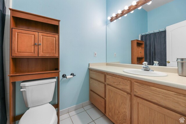 849 E Forest Farm Cir S, Salt Lake City, UT 84106 - bathroom featuring tile patterned flooring, vanity, toilet, baseboards, and a shower with shower curtain