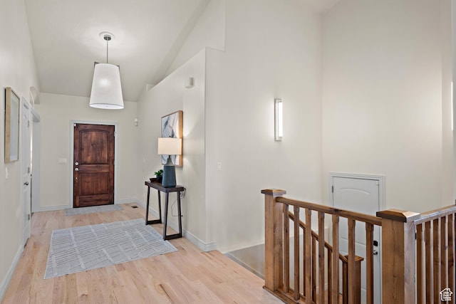 927 S Iris Ln W, Mapleton, UT 84664 - foyer entrance with baseboards, high vaulted ceiling, and light wood-type flooring