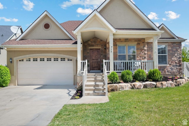 view of front facade with a garage, driveway, stone siding, and stucco siding