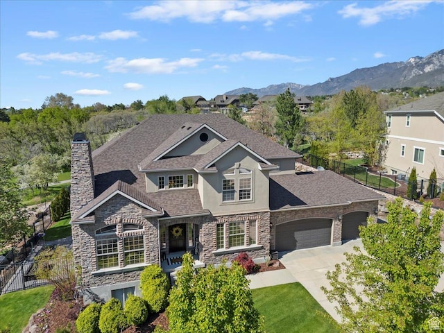 2077 E Genova Dr S, Draper, UT 84020 - view of front of property featuring a garage, fence, stone siding, stucco siding, and concrete driveway