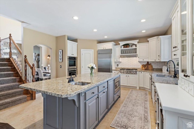 2077 E Genova Dr S, Draper, UT 84020 - kitchen with a sink, white cabinetry, built in appliances, and gray cabinetry
