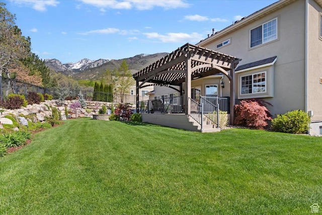 2077 E Genova Dr S, Draper, UT 84020 - rear view of house featuring a lawn, fence, a mountain view, a pergola, and stucco siding