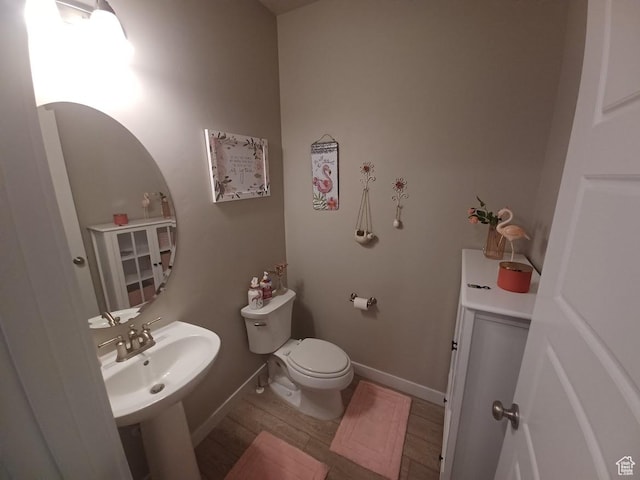 1831 S 2525 W Unit 103, West Haven, UT 84401 - bathroom with wood finished floors, toilet, and a sink