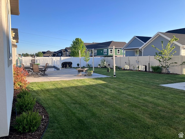 1831 S 2525 W Unit 103, West Haven, UT 84401 - view of yard featuring a patio and a residential view