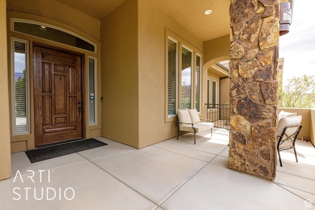 415 W Silver Hills Rd, Leeds, UT 84746 - view of exterior entry with a porch, stone siding, and stucco siding