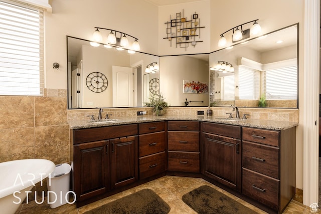 415 W Silver Hills Rd, Leeds, UT 84746 - full bathroom featuring tile walls, plenty of natural light, and a sink