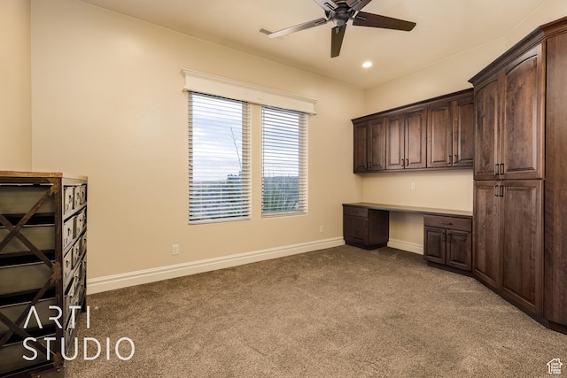 415 W Silver Hills Rd, Leeds, UT 84746 - unfurnished office featuring baseboards, ceiling fan, dark carpet, and built in study area