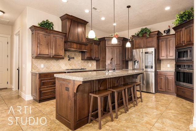 415 W Silver Hills Rd, Leeds, UT 84746 - kitchen with a sink, stainless steel appliances, visible vents, premium range hood, and tasteful backsplash