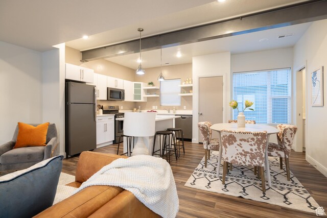 1602 E 3300 S, Millcreek, UT 84106 - interior space featuring baseboards, beamed ceiling, dark wood-style flooring, and visible vents