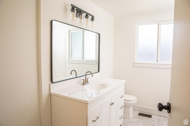 8193 S 1330 E, Sandy, UT 84093 - bathroom featuring toilet, marble finish floors, vanity, and baseboards