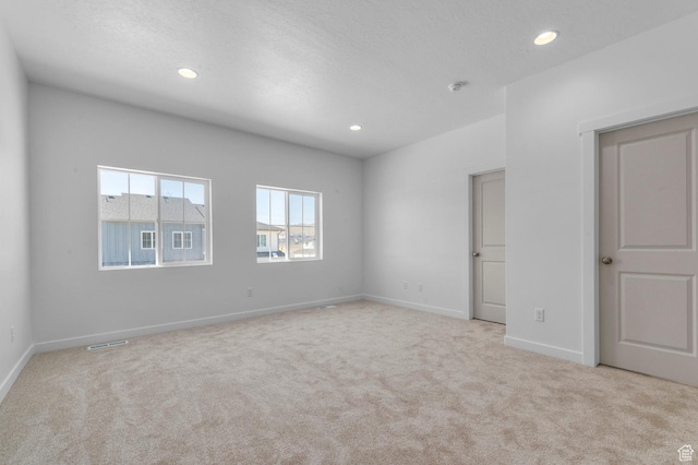 interior space featuring baseboards, carpet flooring, and recessed lighting