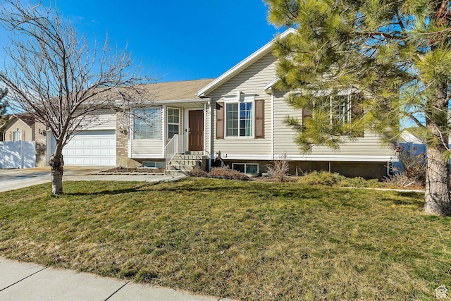 5943 N Genoa Ln W, Stansbury Park, UT 84074 - single story home featuring entry steps, an attached garage, concrete driveway, and a front yard