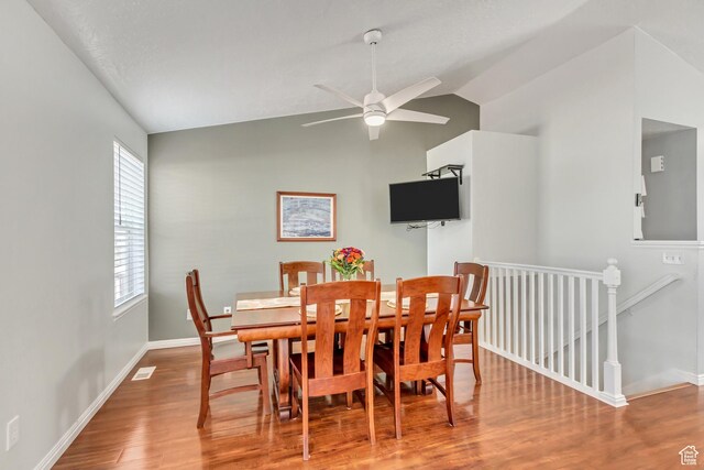 5943 N Genoa Ln W, Stansbury Park, UT 84074 - dining area with baseboards, a ceiling fan, wood finished floors, and vaulted ceiling