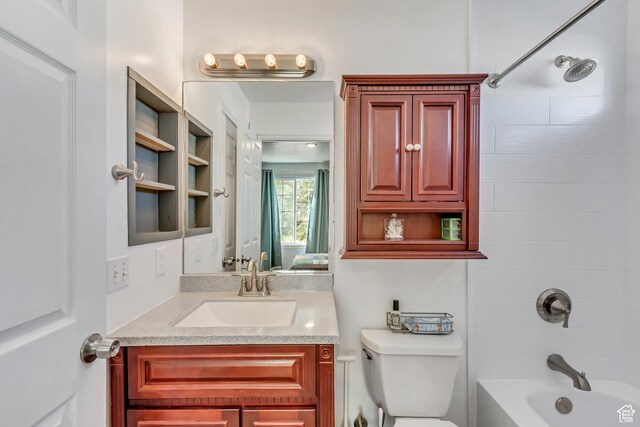 5943 N Genoa Ln W, Stansbury Park, UT 84074 - bathroom featuring vanity, shower / bath combination, and toilet