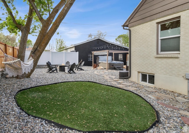 740 E Barrows Ave, Salt Lake City, UT 84106 - view of yard featuring a hot tub, a patio, and an outdoor fire pit