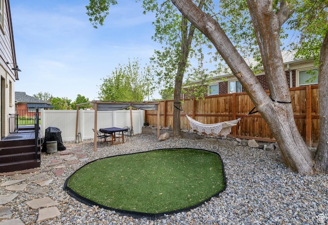 740 E Barrows Ave, Salt Lake City, UT 84106 - fenced backyard featuring an area to practice putting and a patio area