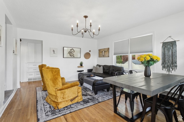 740 E Barrows Ave, Salt Lake City, UT 84106 - living room featuring a chandelier and hardwood / wood-style flooring