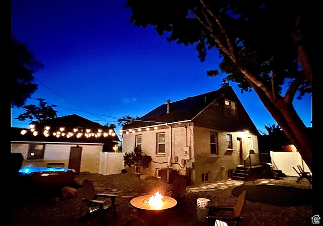740 E Barrows Ave, Salt Lake City, UT 84106 - view of front of house with an outdoor fire pit and fence
