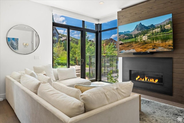 4134 Cooper Ln Unit 22, Park City, UT 84098 - living room featuring recessed lighting, a glass covered fireplace, wood finished floors, and a wealth of natural light