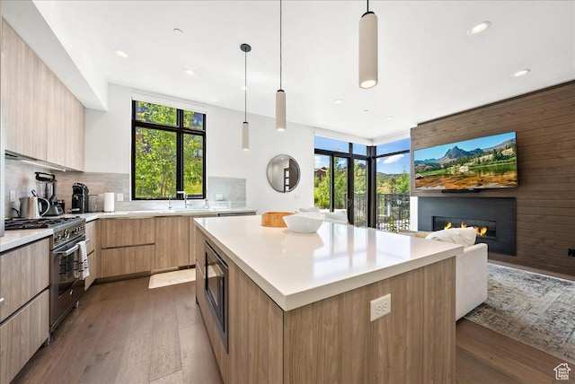 4134 Cooper Ln Unit 22, Park City, UT 84098 - kitchen with wood-type flooring, light brown cabinets, modern cabinets, gas range, and built in microwave