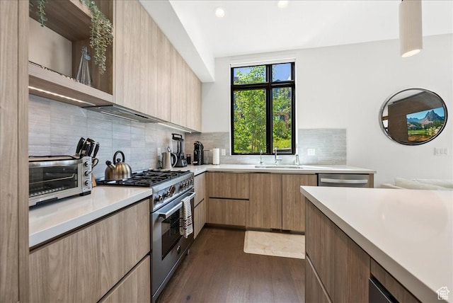 4134 Cooper Ln Unit 22, Park City, UT 84098 - kitchen featuring appliances with stainless steel finishes, a sink, light countertops, dark wood-style floors, and modern cabinets