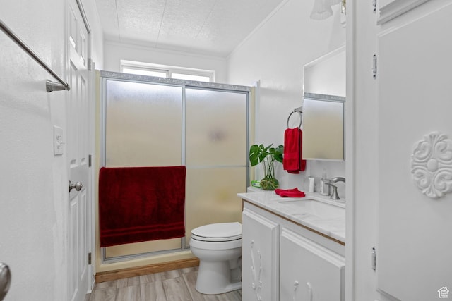 1526 N Dixie Downs Dr Unit 53, St George, UT 84770 - full bathroom with vanity, toilet, a textured ceiling, a shower stall, and wood finished floors