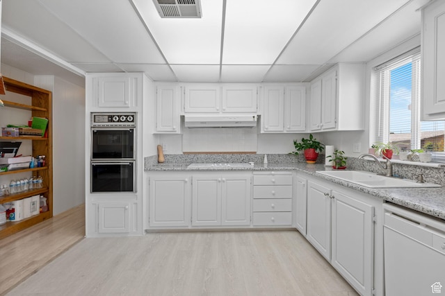 1526 N Dixie Downs Dr Unit 53, St George, UT 84770 - kitchen with a sink, light wood finished floors, white appliances, under cabinet range hood, and visible vents