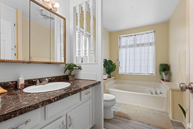 1526 N Dixie Downs Dr Unit 53, St George, UT 84770 - full bath featuring wood finished floors, a bath, toilet, and vanity