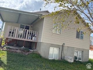 6267 S Waller Ln W, West Jordan, UT 84081 - rear view of property with a lawn and a deck