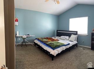 6267 S Waller Ln W, West Jordan, UT 84081 - carpeted bedroom with baseboards, a ceiling fan, and vaulted ceiling