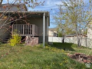 6267 S Waller Ln W, West Jordan, UT 84081 - view of side of property featuring a fenced backyard and a yard