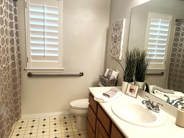 986 Davenport Dr S, Grantsville, UT 84029 - full bathroom with toilet, a shower with shower curtain, tile patterned floors, baseboards, and vanity