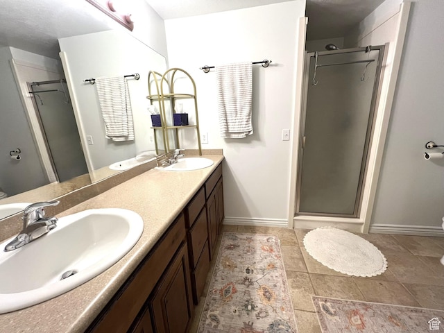 986 Davenport Dr S, Grantsville, UT 84029 - bathroom featuring a sink, double vanity, a stall shower, and tile patterned flooring