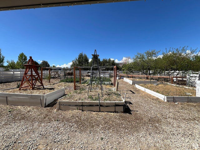 986 Davenport Dr S, Grantsville, UT 84029 - view of jungle gym featuring a garden and fence