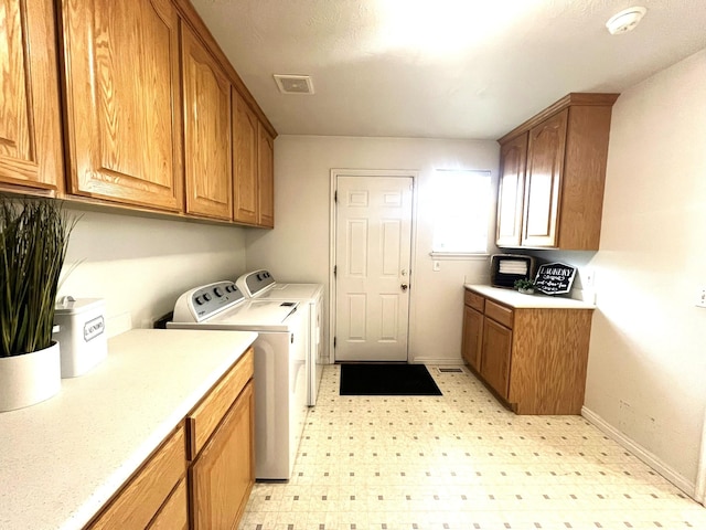986 Davenport Dr S, Grantsville, UT 84029 - clothes washing area featuring cabinet space, washing machine and clothes dryer, light floors, visible vents, and baseboards