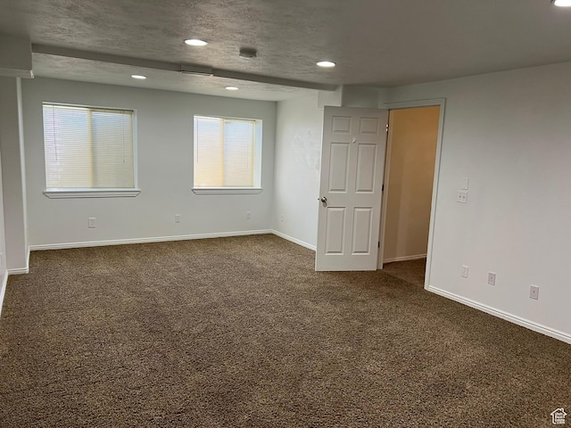 986 Davenport Dr S, Grantsville, UT 84029 - unfurnished room featuring dark carpet, baseboards, and recessed lighting