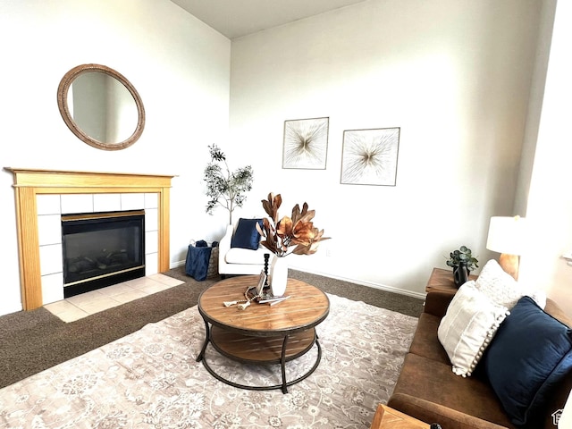 986 Davenport Dr S, Grantsville, UT 84029 - carpeted living area featuring a tile fireplace and baseboards