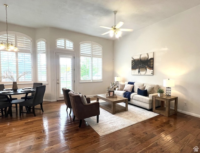 986 Davenport Dr S, Grantsville, UT 84029 - living room with baseboards, dark wood finished floors, plenty of natural light, and ceiling fan with notable chandelier
