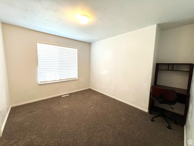 986 Davenport Dr S, Grantsville, UT 84029 - spare room with a textured ceiling, visible vents, baseboards, and dark carpet