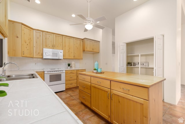 423 W Taman Ct, Ivins, UT 84738 - kitchen with a sink, white appliances, wooden counters, a ceiling fan, and backsplash