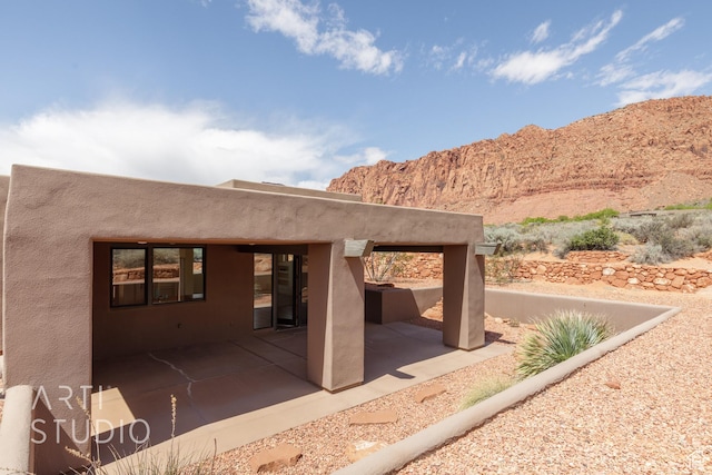423 W Taman Ct, Ivins, UT 84738 - view of patio / terrace with a mountain view