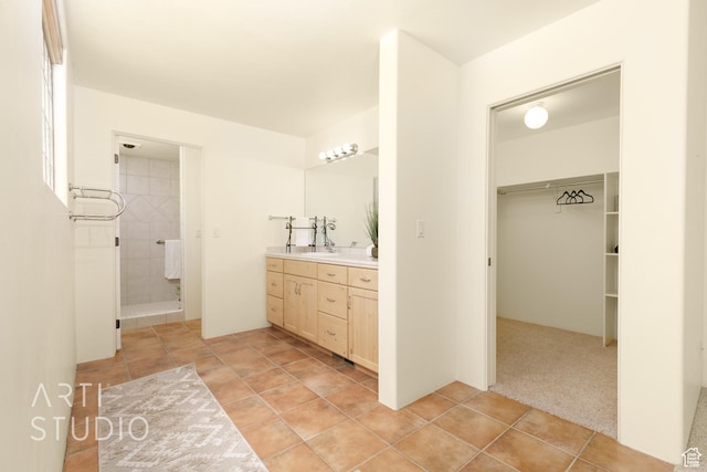423 W Taman Ct, Ivins, UT 84738 - full bathroom featuring double vanity, a sink, tile patterned floors, a spacious closet, and tiled shower