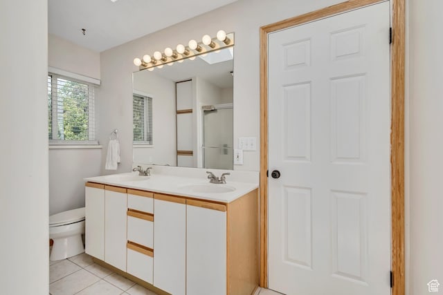 1253 Oakridge Ln, Bountiful, UT 84010 - bathroom with toilet, double vanity, tile patterned floors, and an enclosed shower
