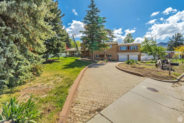 1253 Oakridge Ln, Bountiful, UT 84010 - view of front of home featuring decorative driveway, an attached garage, and a front yard