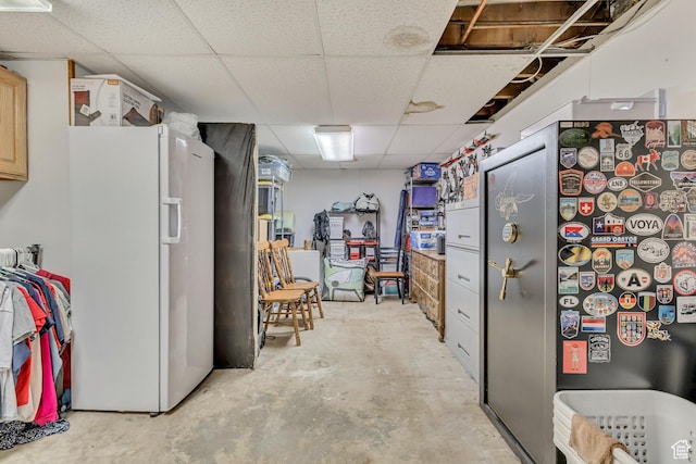 1253 Oakridge Ln, Bountiful, UT 84010 - kitchen featuring freestanding refrigerator, a paneled ceiling, and unfinished concrete flooring