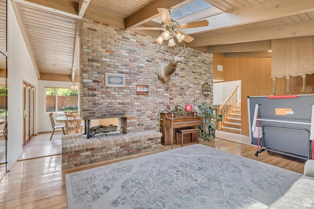 1253 Oakridge Ln, Bountiful, UT 84010 - living area featuring ceiling fan, wooden ceiling with exposed beams, wood finished floors, stairway, and a fireplace