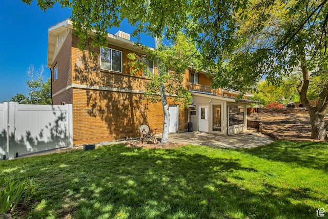 1253 Oakridge Ln, Bountiful, UT 84010 - back of house with brick siding and a patio area
