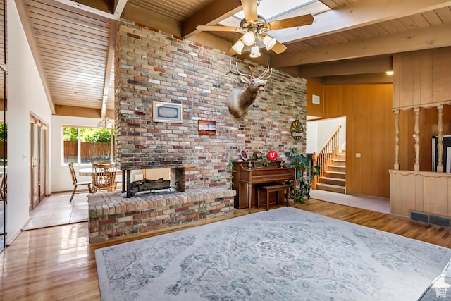 1253 Oakridge Ln, Bountiful, UT 84010 - living area featuring wood ceiling with exposed beams, wood finished floors, stairway, ceiling fan, and wooden walls